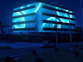 The Scarborough building wrapped in a blue, swirly, 3D mapping projection