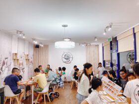 Groups of people dining at Hakusho Cafe.